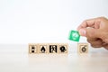 Close-up hand choose wooden toy blocks stacked with fire protect icon Royalty Free Stock Photo