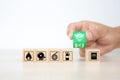 Close-up hand choose wooden toy blocks stacked with protect and door exit sing Royalty Free Stock Photo