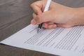 Close up of hand completing an employment application form