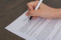 Close up of hand completing an employment application form