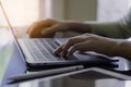 Woman hand work on laptop computer and using wireless mouse Remote working, telework concept. Royalty Free Stock Photo