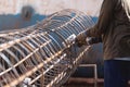 Close up hand Construction workers fabricating steel reinforcement bar at the construction site