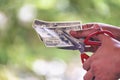 Close up hand cutting money usd banknote. Woman hand cuts money debt with scissors. Close up Hands holding scissors cutting 100 Royalty Free Stock Photo