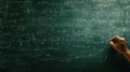 Complex Math Formulas and Equations Written on a Chalkboard with Hand and Pencil Royalty Free Stock Photo