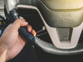 Close up hand driver control of car steering wheel Royalty Free Stock Photo