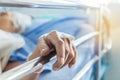 Close up hand of elderly patient with intravenous catheter for injection plug in the vein during lying Royalty Free Stock Photo