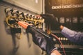Close-up hand of electrical engineer using measuring equipment to checking electric current voltage at circuit breaker Royalty Free Stock Photo