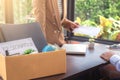 Close up of the hand employer filing final remuneration to resignation employee packing up all his personal belongings and files Royalty Free Stock Photo