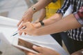 Close up of hand engineer meeting for architectural project working with partner and engineering tools on workplace. Royalty Free Stock Photo