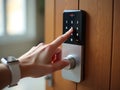 Person Entering a Code on a Smart Door Lock Royalty Free Stock Photo
