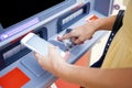 Close up of hand entering pin at an ATM. Finger about to press a Royalty Free Stock Photo