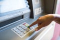 Close up of hand entering pin code at atm machine Royalty Free Stock Photo