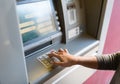 Close up of hand entering pin code at atm machine Royalty Free Stock Photo