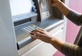 Close up of hand entering pin code at atm machine Royalty Free Stock Photo