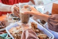 Close up of the hand of the female stall waitress giving a glass of drink to the customer