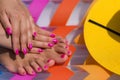 Close-up hand and foot on a pink air mattress in swimming pool. Royalty Free Stock Photo