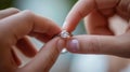 close-up of a hand gently placing an engagement ring with a large diamond on the ring finger of another hand.AI generated image Royalty Free Stock Photo