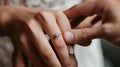 close-up of a hand gently placing an engagement ring with a large diamond on the ring finger of another hand.AI generated image Royalty Free Stock Photo