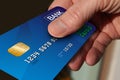 Close up of hand giving credit card Royalty Free Stock Photo