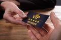 Person Giving Vip Card