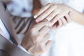 Close up hand groom couple put giving the Wedding Ring on bride. Royalty Free Stock Photo