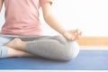 Close up hand and half body of healthy woman sit in lotus Yoga position.Young healthy woman sitting posture exercise in home. Royalty Free Stock Photo