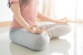 Close up hand and half body of healthy woman sit  lotus Yoga position.Young healthy woman sitting posture exercise in home. Royalty Free Stock Photo