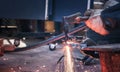 Close up hand heavy industrial worker is working on metal work factory process by Cutting sheet. Royalty Free Stock Photo