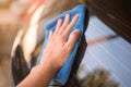 Close up hand hold Car Wipes on Car Mirror Royalty Free Stock Photo
