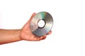 Close up hand hold CD compact disc, DVD, isolated on white background. Royalty Free Stock Photo