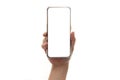 Close up hand hold phone isolated on white, mock-up smartphone white color blank screen, vertical position