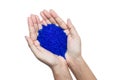 Close up of hand holding blue silica gel Royalty Free Stock Photo