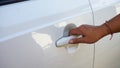 Close up hand holding car door handle Royalty Free Stock Photo