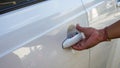 Close up hand holding the car door handle Royalty Free Stock Photo