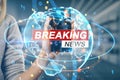 Close up of hand holding cellphone with creative breaking news and globe hologram on blurry office interior backdrop. Television, Royalty Free Stock Photo