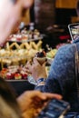 Close-up of hand holding a chocolate dessert with berries on top at an event Royalty Free Stock Photo