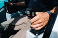 Close up of a hand holding the control stick and ready to work in the truck crane the largest truck crane for challenging tasks