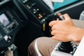 Close up of a hand holding the control stick and ready to work in the truck crane the largest truck crane for challenging tasks