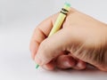 Close up of hand holding crayon Royalty Free Stock Photo