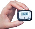 Close-up Of Hand Holding Digital Pedometer On Royalty Free Stock Photo