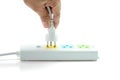 Close-up, Hand holding an electric plug ready to connect power strip on white background