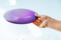 close up of hand holding flying disc Royalty Free Stock Photo