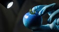 Close-Up of a Hand Holding a Fresh Blue Tomato under a Bright LED Light in Studio Royalty Free Stock Photo