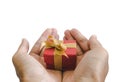 Close-up hand holding, giving or receiving gift box, isolated on white background Royalty Free Stock Photo