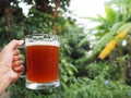 Close-up of hand holding a glass of craft beer