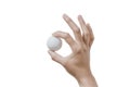 Close up hand holding golf ball on white background. Royalty Free Stock Photo