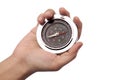 Close up of hand holding magnetic silver metal compass Royalty Free Stock Photo