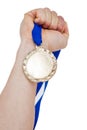 Close-up of hand holding olympic gold medal Royalty Free Stock Photo