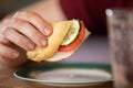 close-up of a hand holding an overbite sandwich. Royalty Free Stock Photo