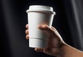 Close-up of a hand holding a paper cup with coffee, mockup illustration for design, Royalty Free Stock Photo